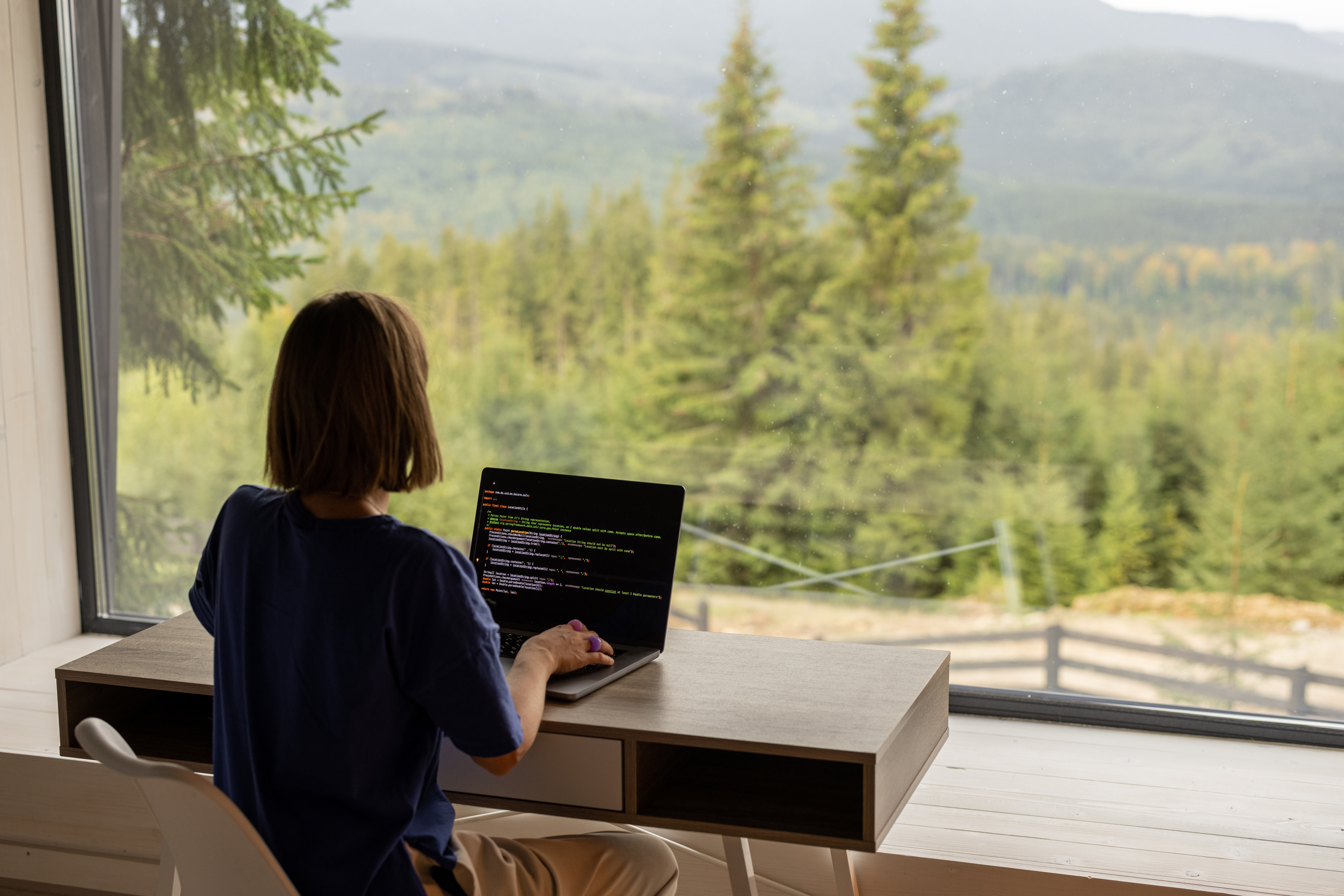 woman working at computer, on her MBA