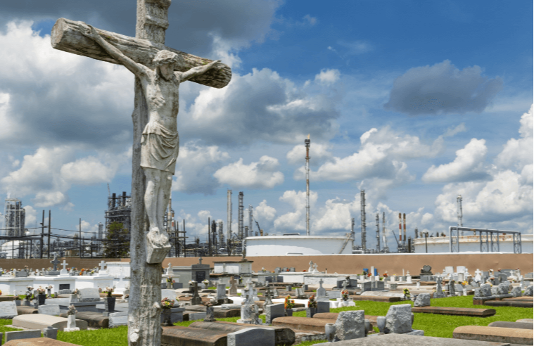 View of the Holy Rosary Cemetery in Taft, Louisiana, with a petrochemical plant on the background- The cemetery is located in the so called Cancer Al